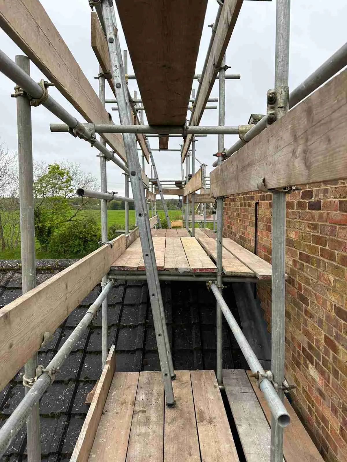 Domestic scaffolding erected by ATC Scaffolding around a house for roofing and exterior works