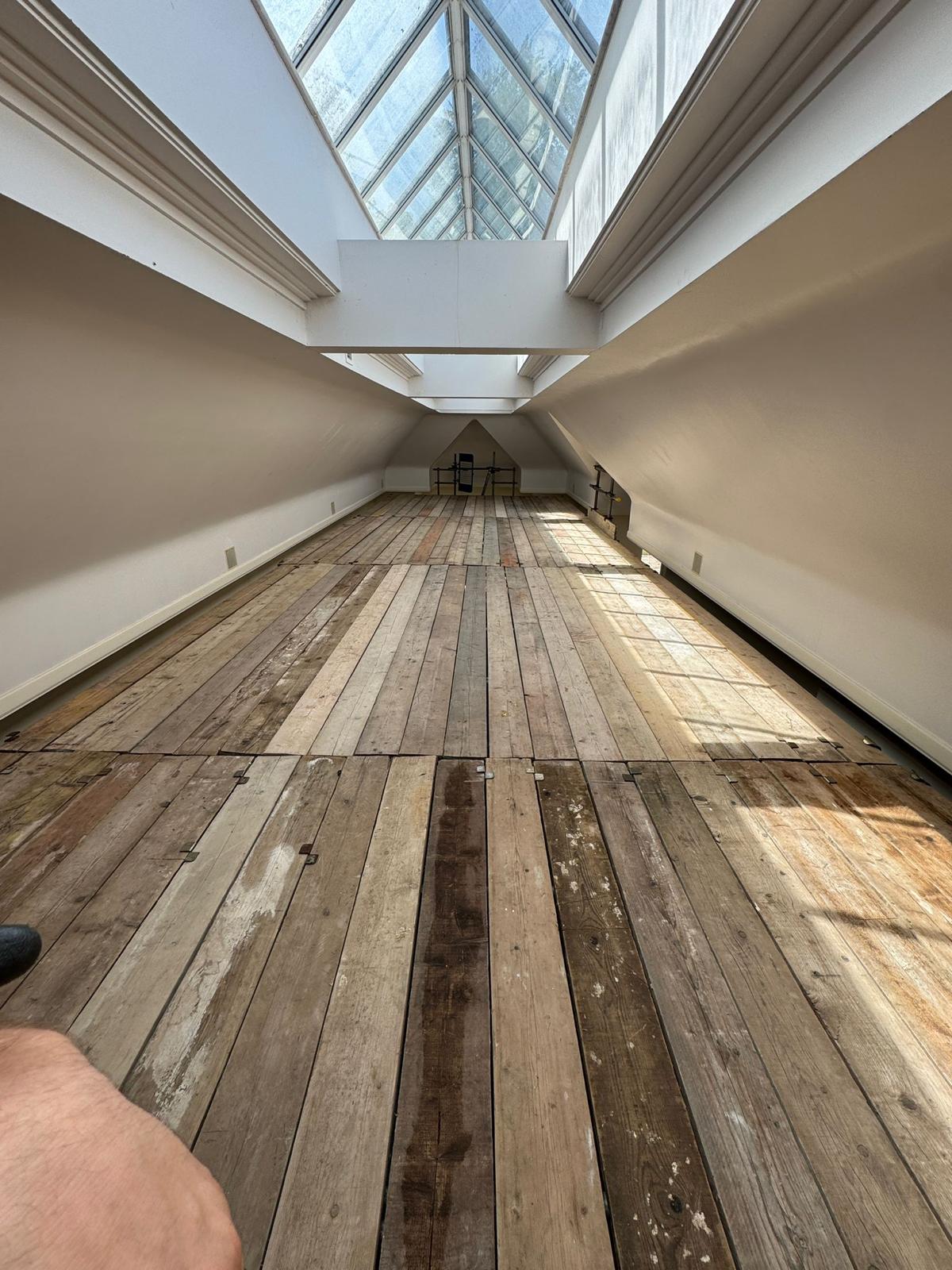 Stripped loft floor and roof structure supported during internal alterations and back propping works