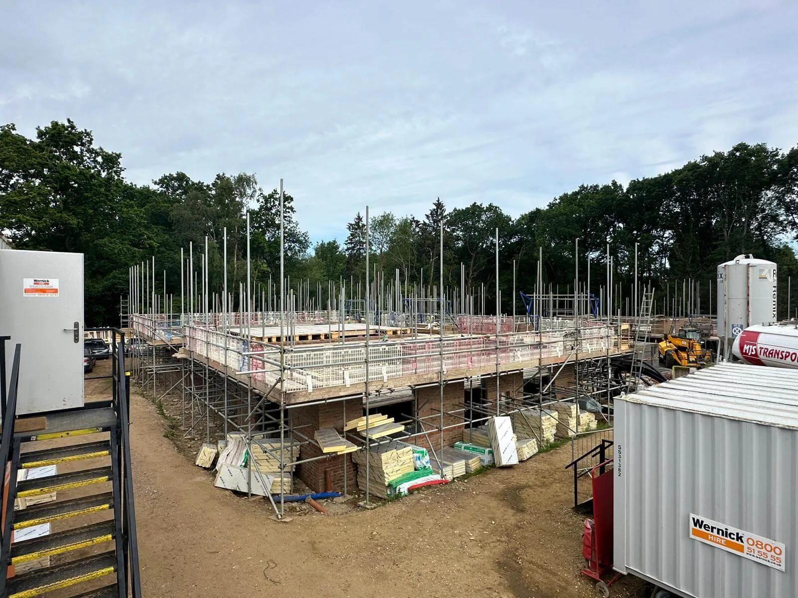 Scaffolding with edge protection sequenced around a new build development for a developer