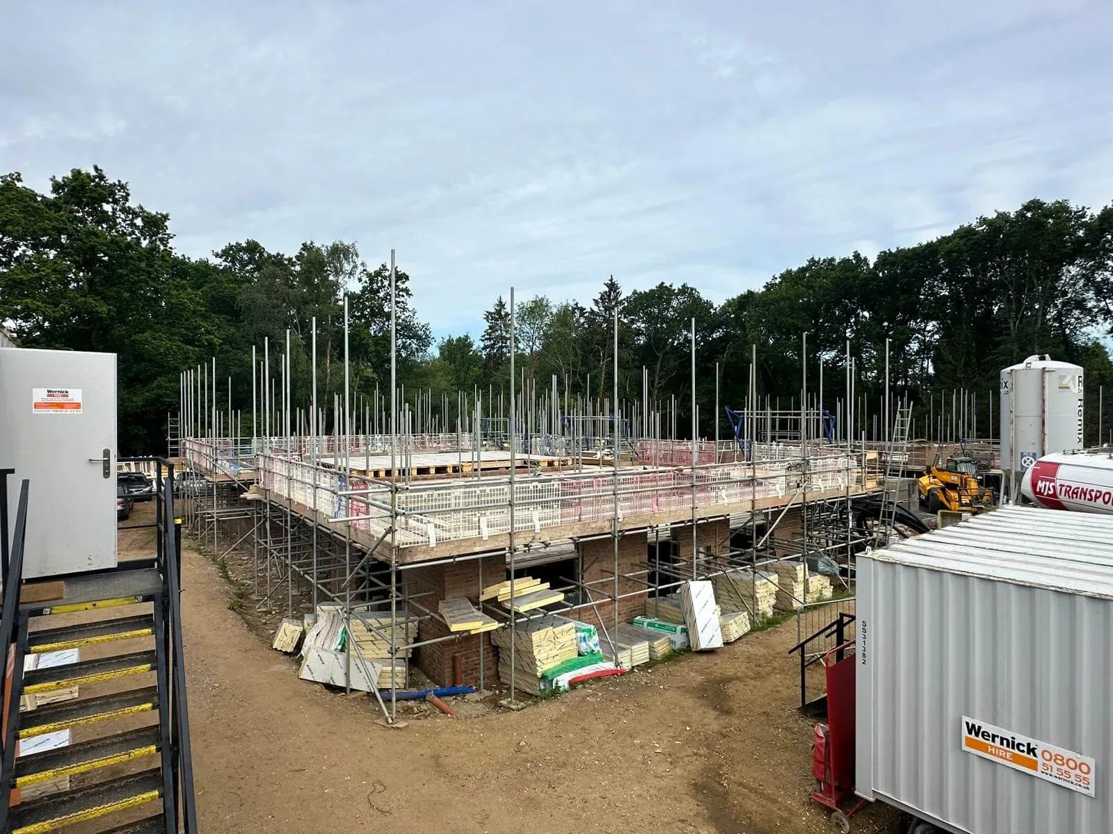 Scaffolding with edge protection sequenced around a new build development for a developer